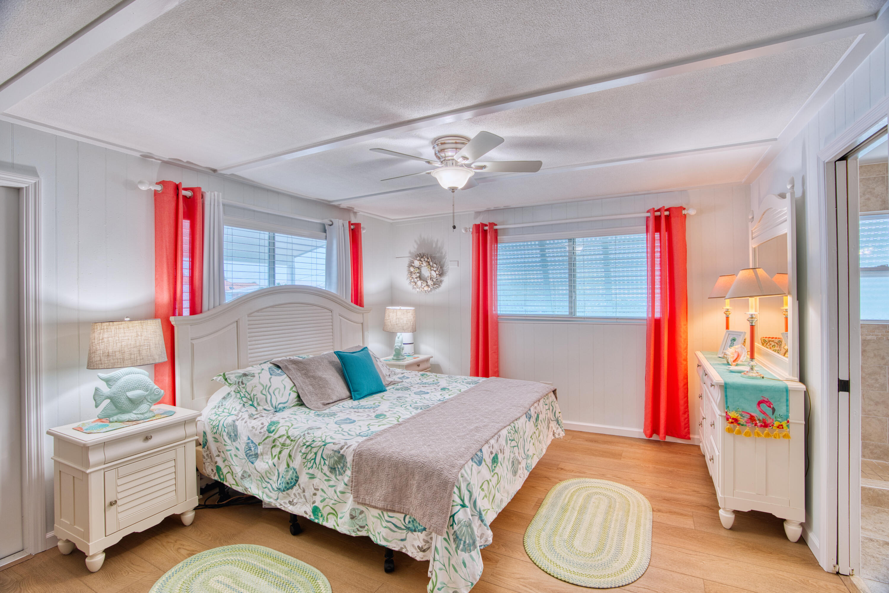 330-340 4th Street Key Colony Beach, FL 33051 - Photo 26 of 68 a bedroom with a bed and a chandelier