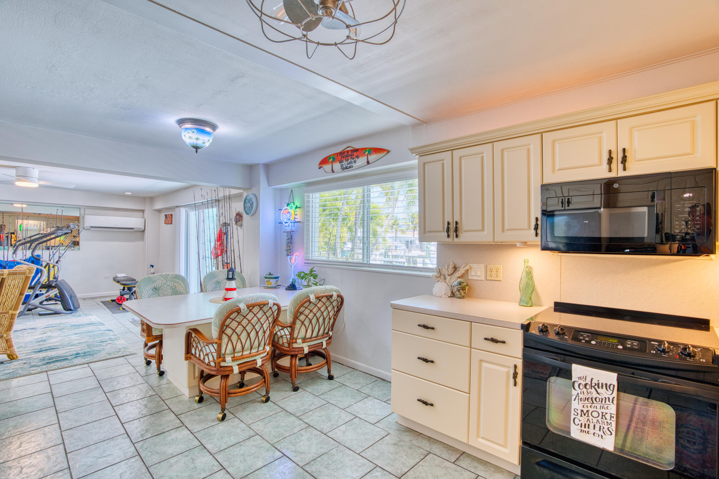 330-340 4th Street Key Colony Beach, FL 33051 - Photo 41 of 68 a kitchen with stainless steel appliances kitchen island granite countertop a sink and cabinets