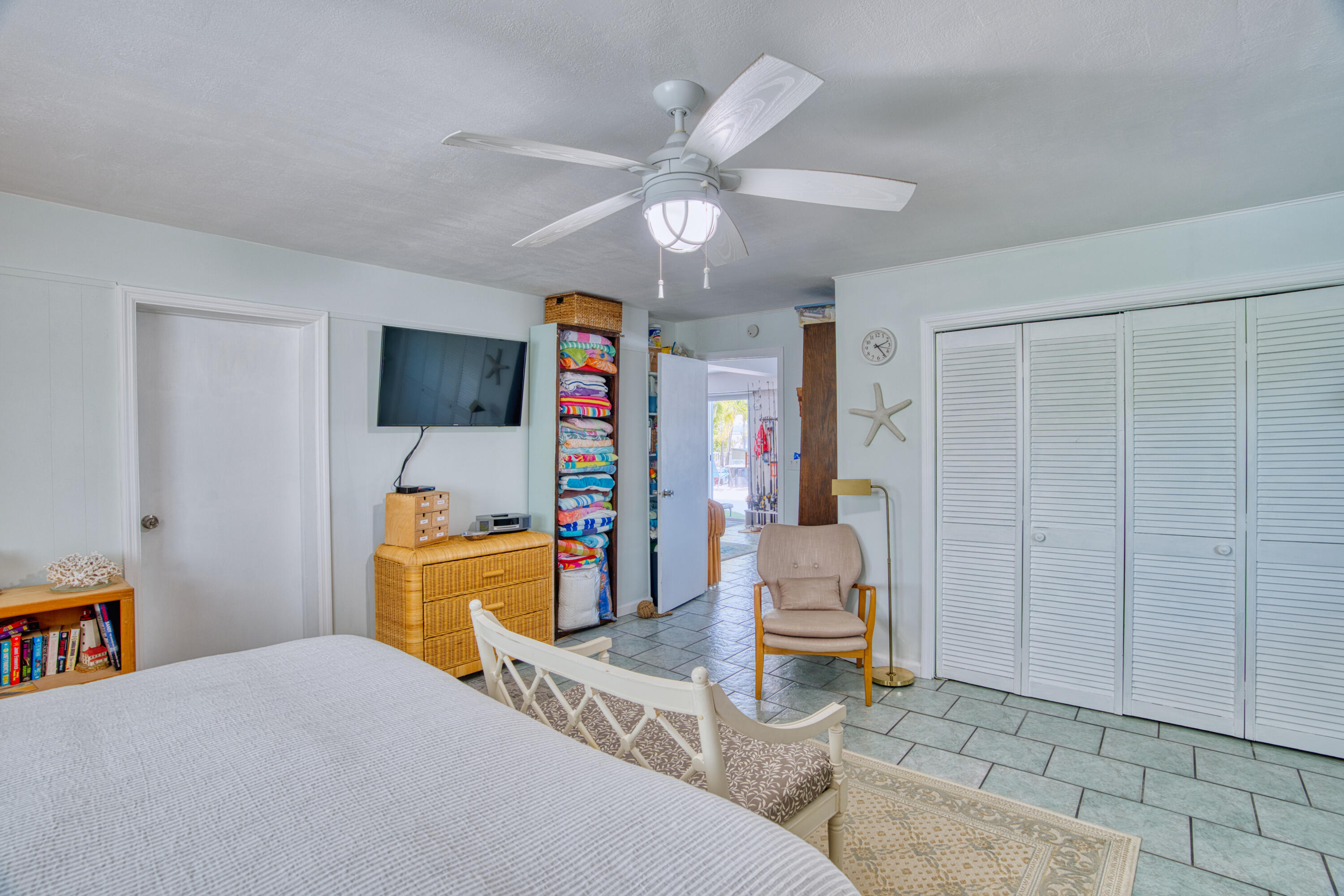 330-340 4th Street Key Colony Beach, FL 33051 - Photo 43 of 68 a bedroom with a bed and a chandelier