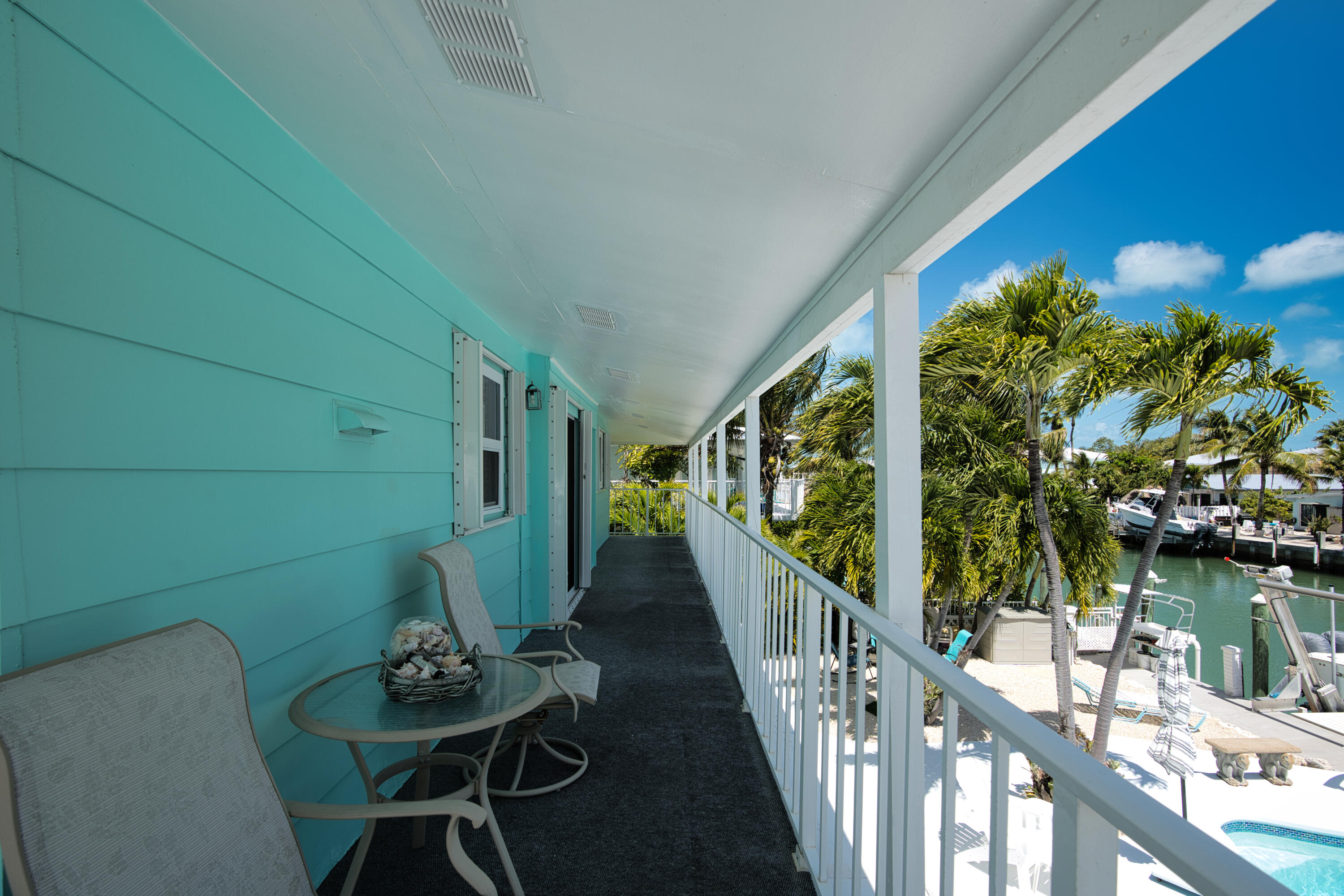 330-340 4th Street Key Colony Beach, FL 33051 - Photo 56 of 68 a view of deck with furniture and garden