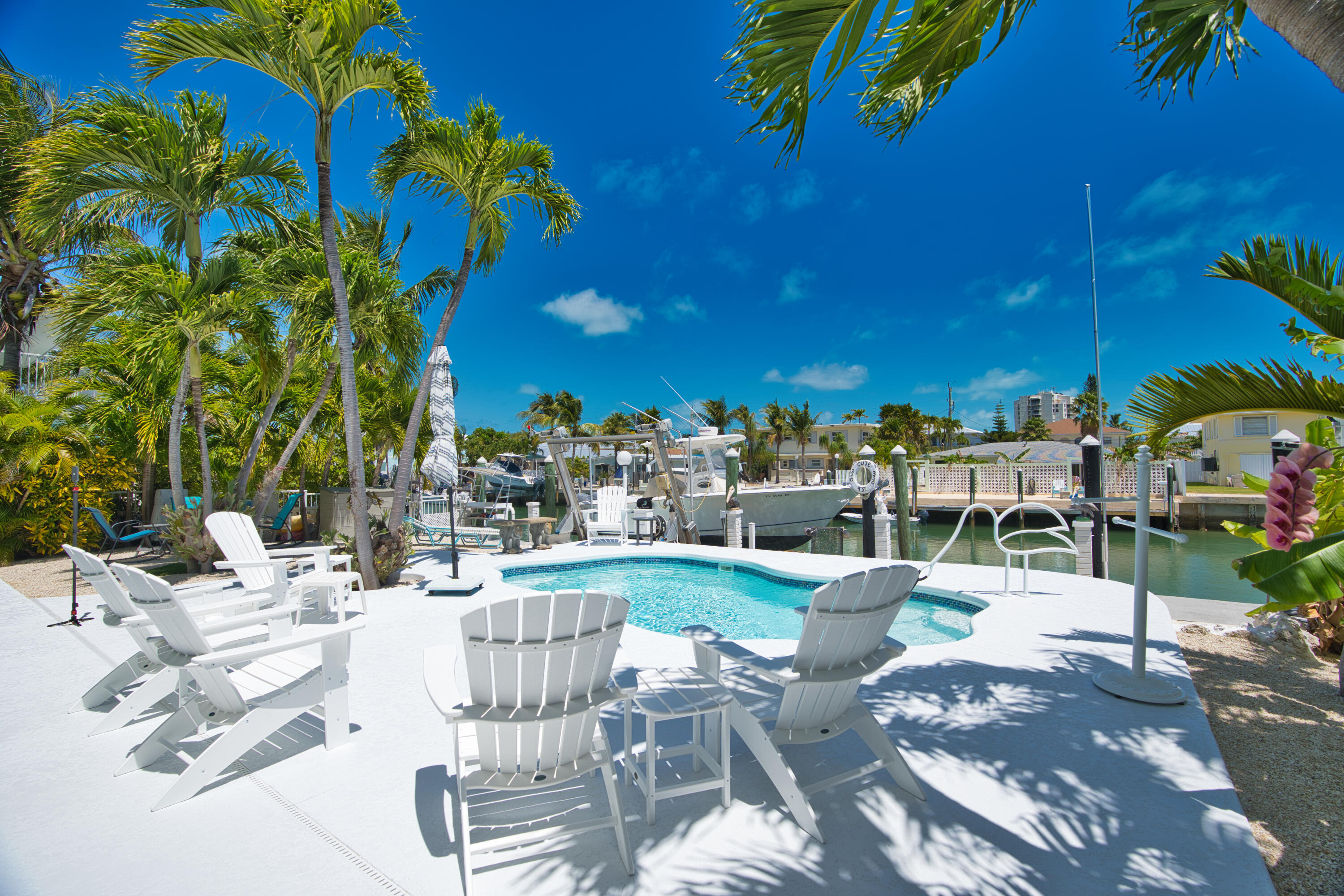 330-340 4th Street Key Colony Beach, FL 33051 - Photo 59 of 68 a view of a patio with couches table and chairs and potted plants