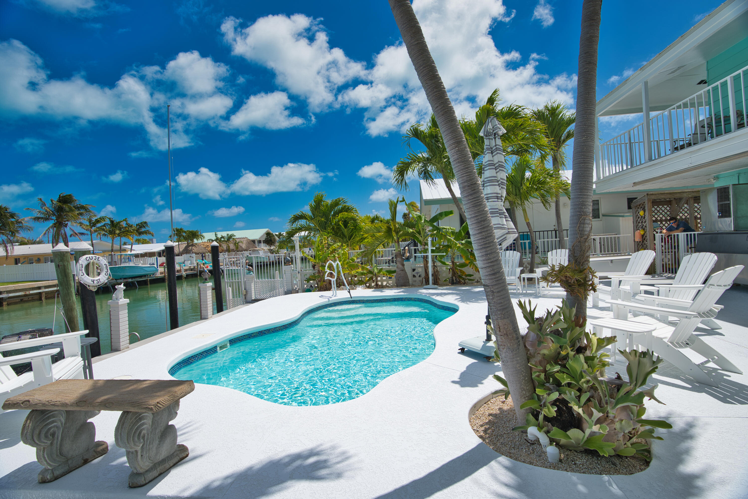 330-340 4th Street Key Colony Beach, FL 33051 - Photo 10 of 68 a view of a backyard with sitting area