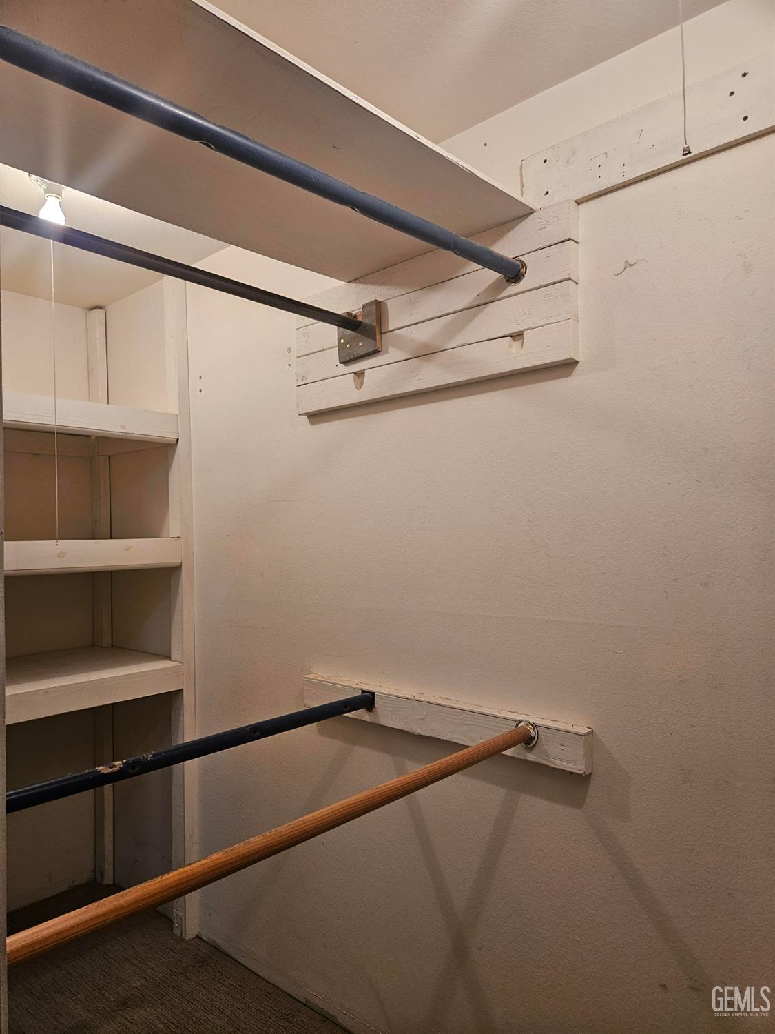 Undisclosed Address Bakersfield, CA 93306 - Photo 11 of 27 a view of a room with racks on the wall