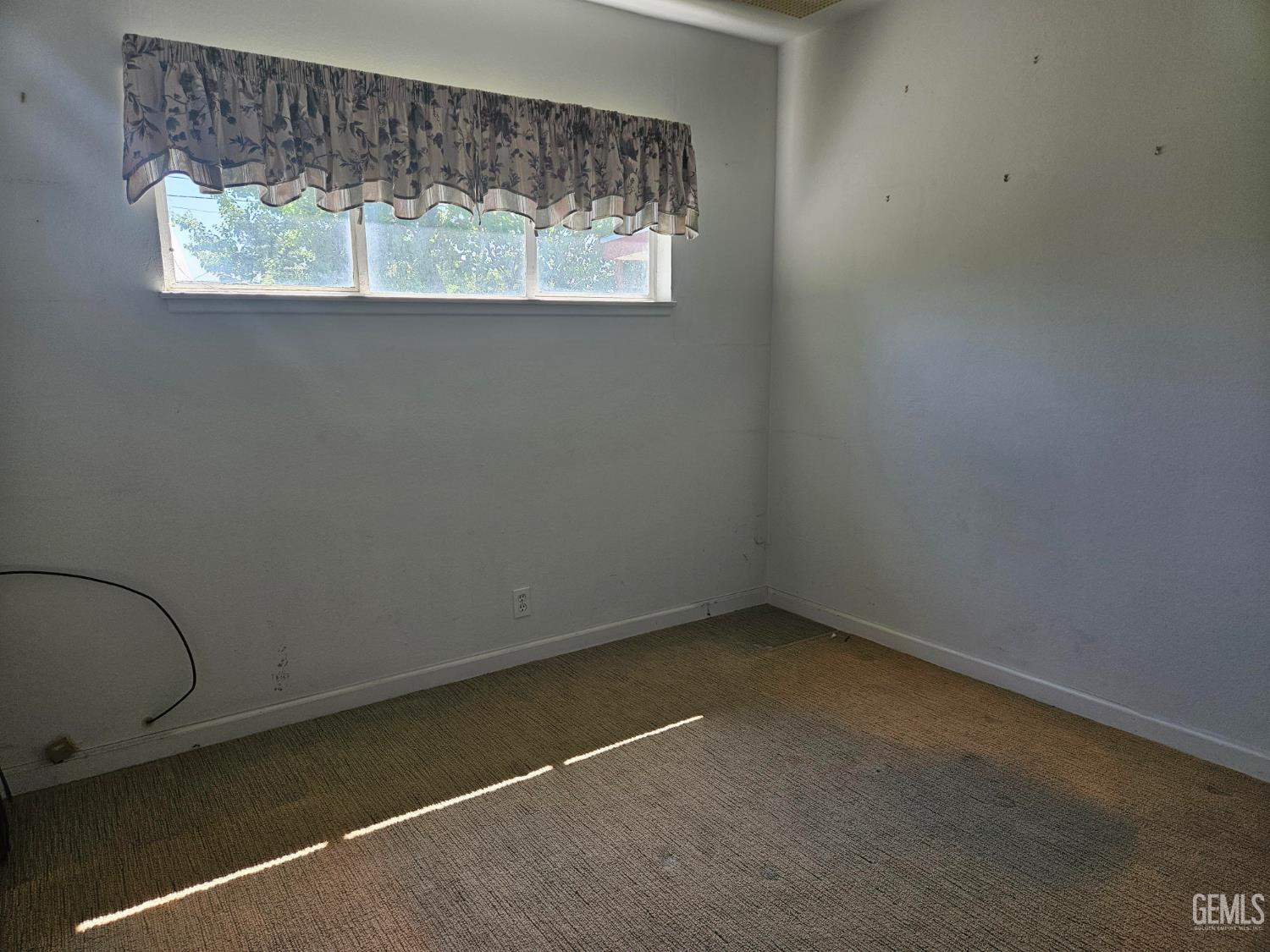 Undisclosed Address Bakersfield, CA 93306 - Photo 15 of 27 an empty room with a window