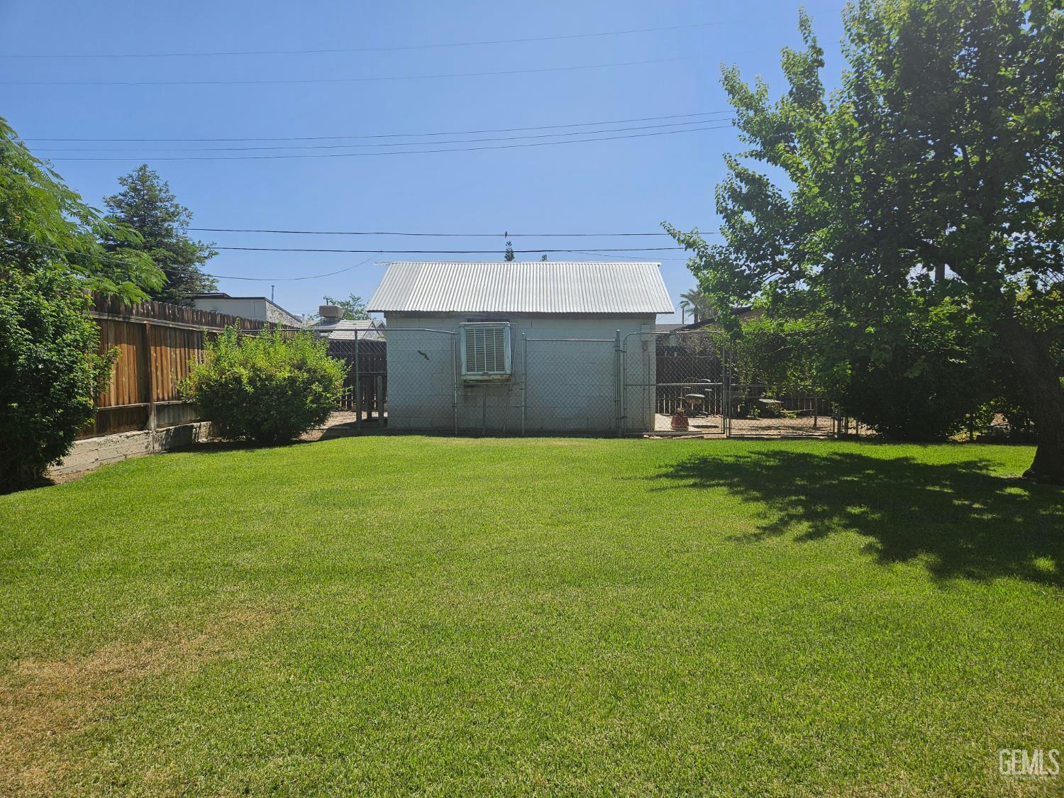 Undisclosed Address Bakersfield, CA 93306 - Photo 20 of 27 a front view of a house with a garden