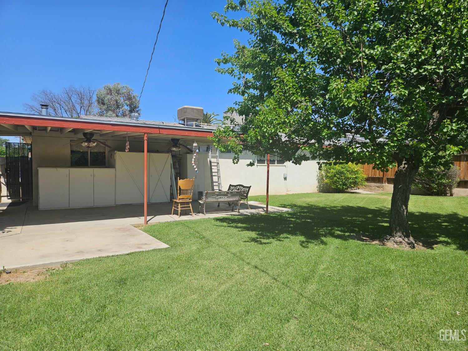 Undisclosed Address Bakersfield, CA 93306 - Photo 25 of 27 a view of a house with backyard and a tree