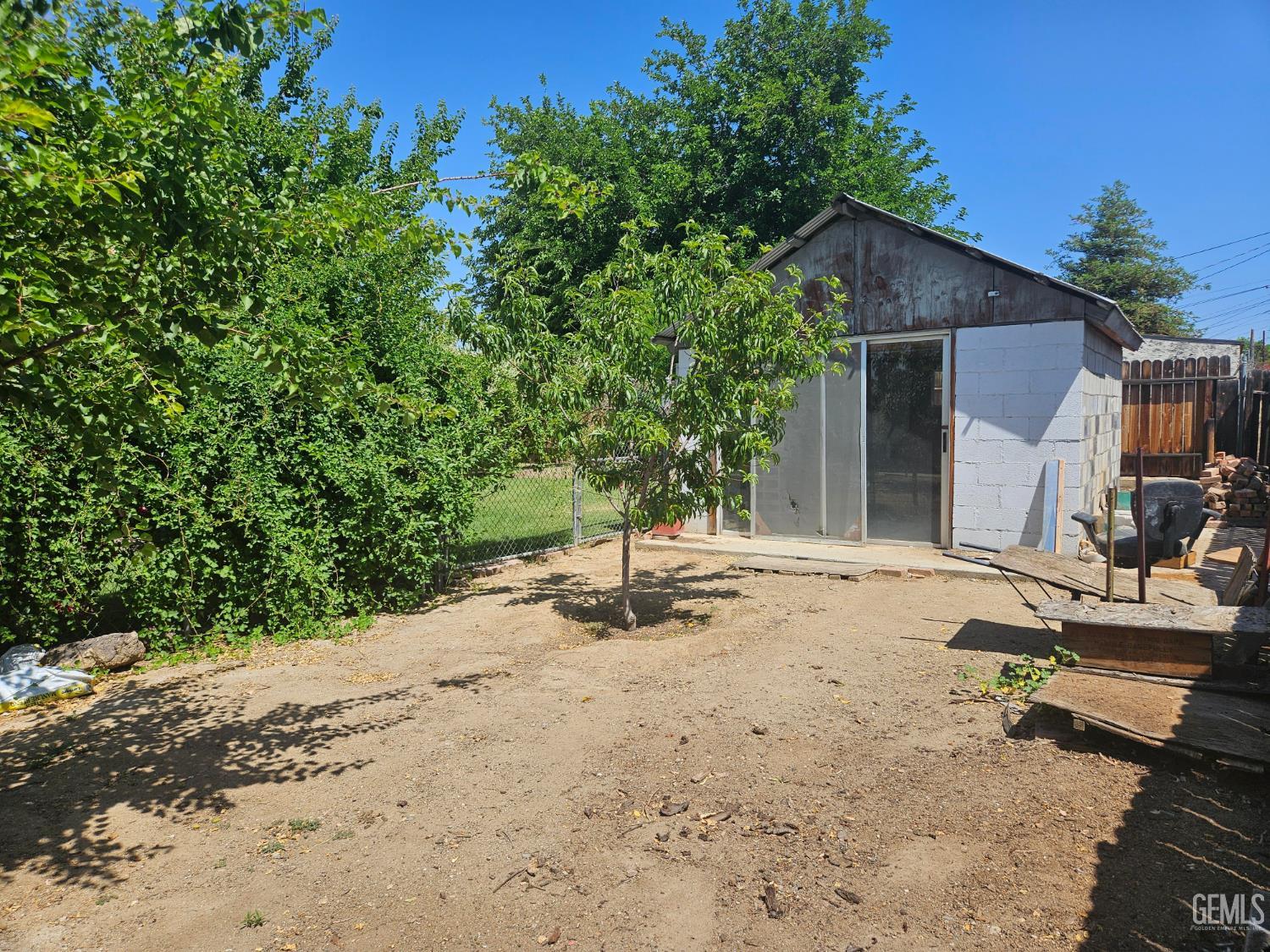 Undisclosed Address Bakersfield, CA 93306 - Photo 27 of 27 a backyard of a house with seating space