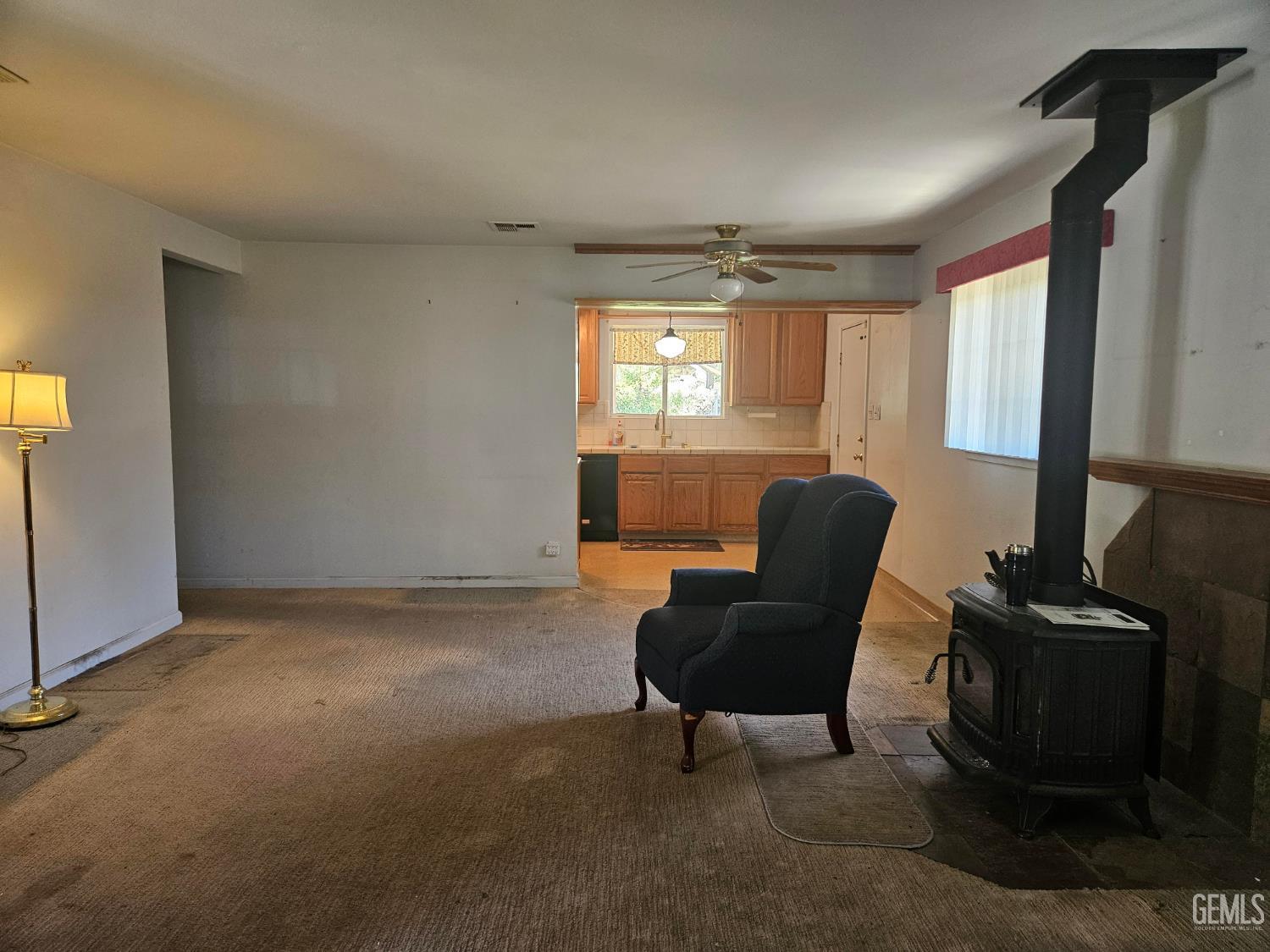 Undisclosed Address Bakersfield, CA 93306 - Photo 6 of 27 a living room with furniture and a window