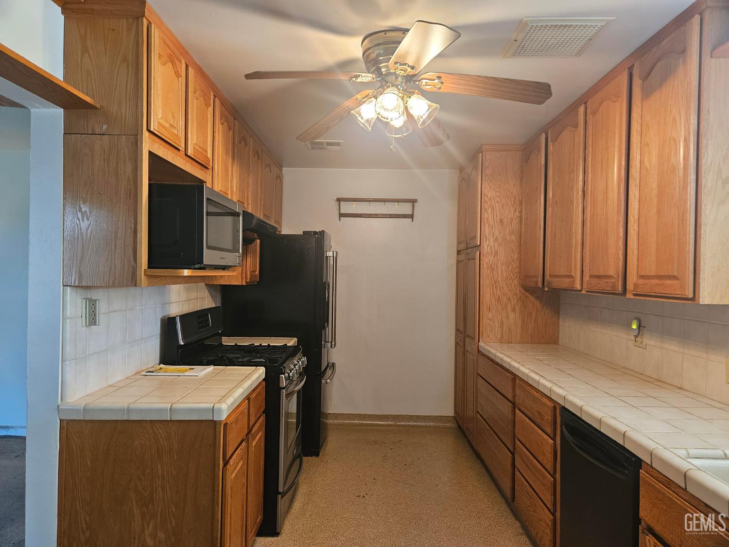 Undisclosed Address Bakersfield, CA 93306 - Photo 7 of 27 a kitchen with stainless steel appliances granite countertop a sink a stove and a refrigerator
