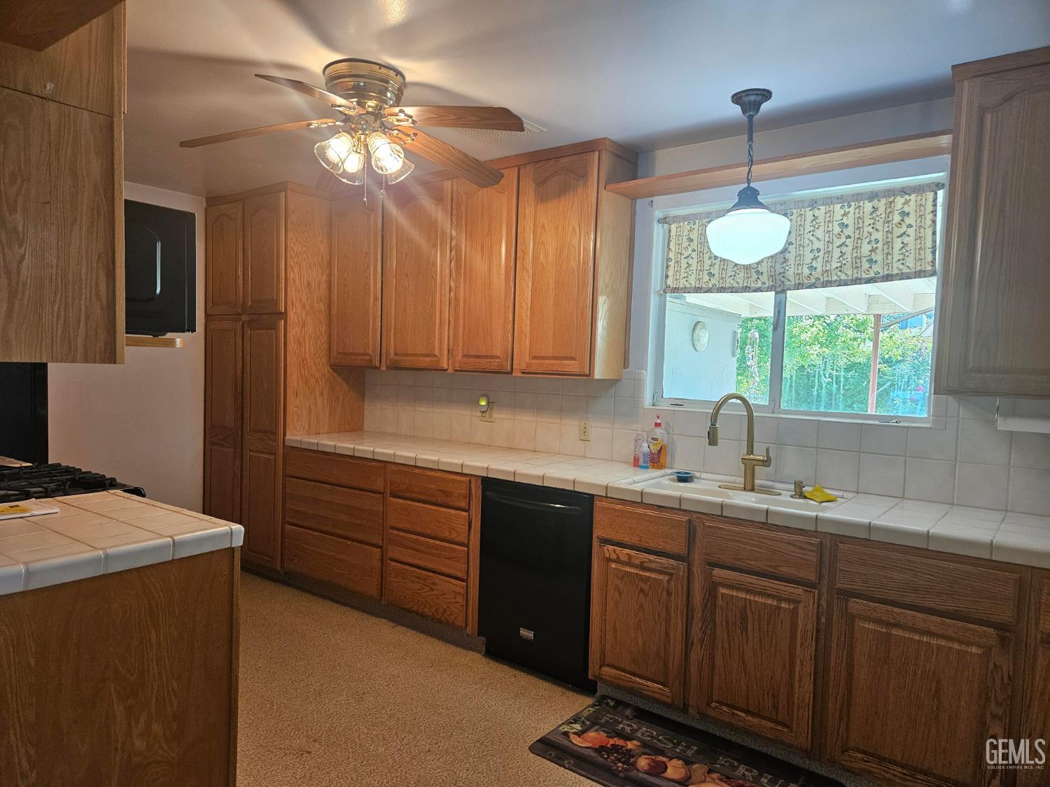 Undisclosed Address Bakersfield, CA 93306 - Photo 8 of 27 a kitchen with sink cabinets and window