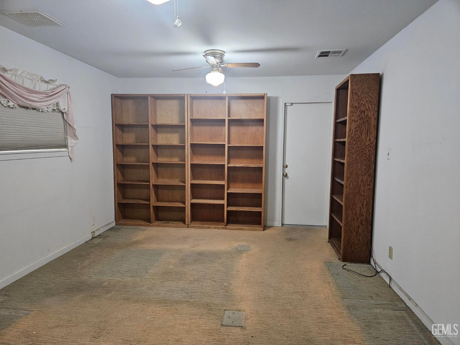 Undisclosed Address Bakersfield, CA 93306 - Photo 10 of 27 a view of an empty room with a closet