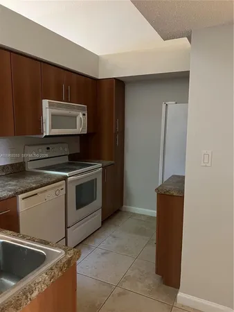 a kitchen with stainless steel appliances cabinets and a counter top
