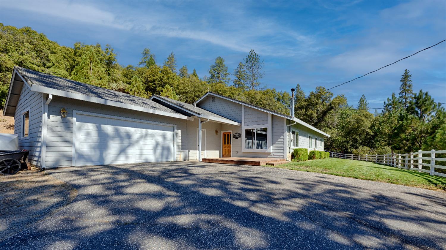 2990 Boole Road Auburn, CA 95603 - Photo 1 of 1 a front view of a house with a yard and potted plants