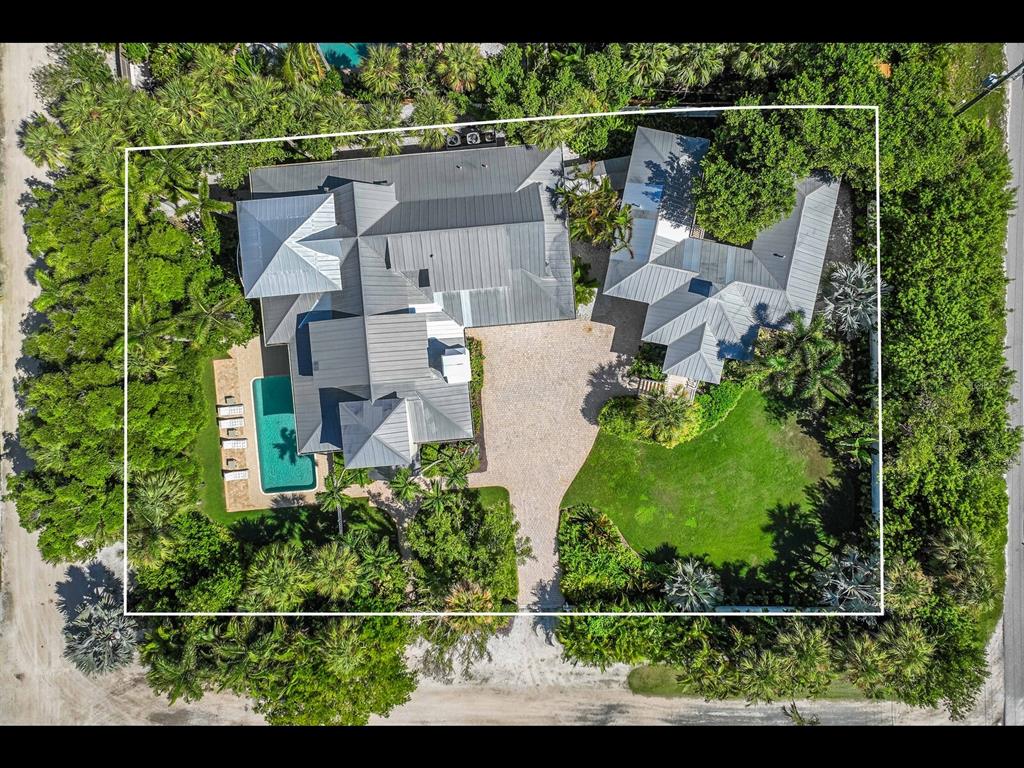 2021 20th Street West Boca Grande, FL 33921 - Photo 1 of 66 an aerial view of a house with a yard