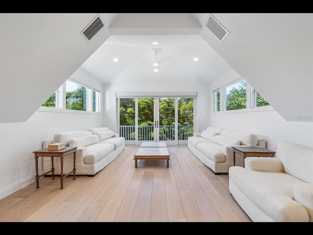 2021 20th Street West Boca Grande, FL 33921 - Photo 17 of 66 a living room with furniture and a large window