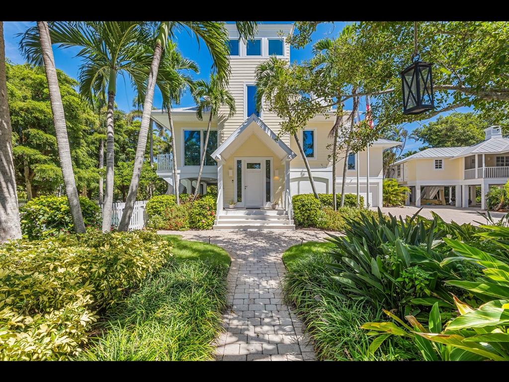 2021 20th Street West Boca Grande, FL 33921 - Photo 2 of 66 front view of a house with a garden