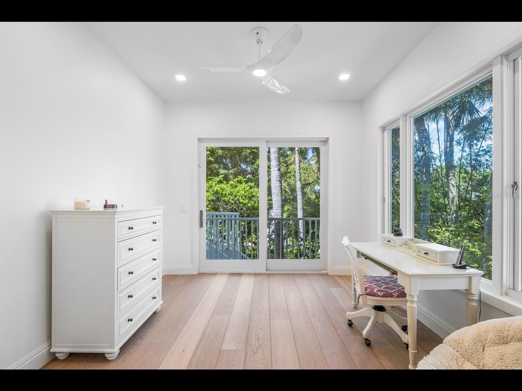 2021 20th Street West Boca Grande, FL 33921 - Photo 28 of 66 a living room with furniture and large windows