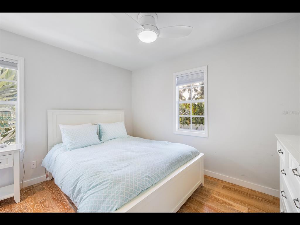 2021 20th Street West Boca Grande, FL 33921 - Photo 30 of 66 a bedroom with a bed and a window