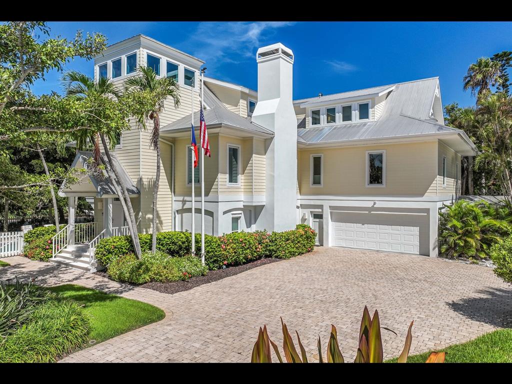 2021 20th Street West Boca Grande, FL 33921 - Photo 3 of 66 a front view of a house with a yard