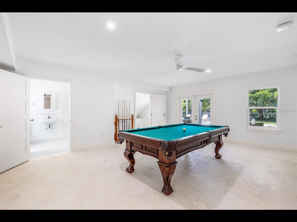 2021 20th Street West Boca Grande, FL 33921 - Photo 38 of 66 a living room with furniture pool table and a window