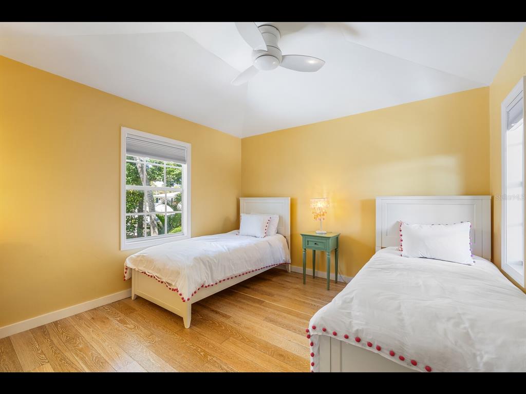 2021 20th Street West Boca Grande, FL 33921 - Photo 49 of 66 a bedroom with a bed and window