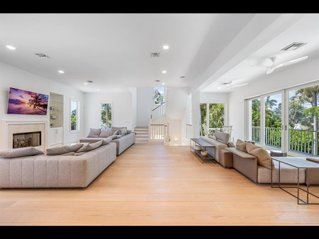 2021 20th Street West Boca Grande, FL 33921 - Photo 5 of 66 a living room with furniture and a fireplace