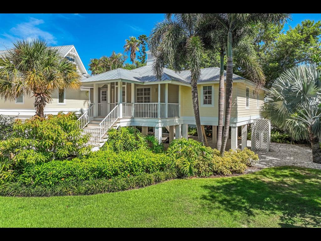 2021 20th Street West Boca Grande, FL 33921 - Photo 59 of 66 a front view of a house with garden