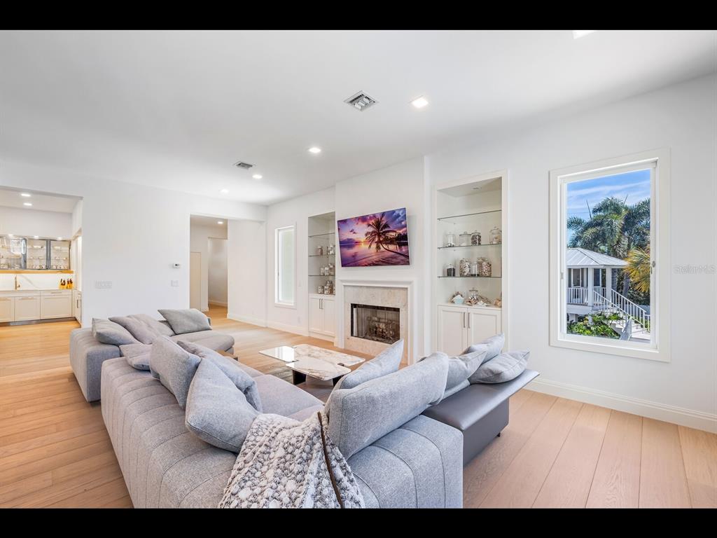 2021 20th Street West Boca Grande, FL 33921 - Photo 10 of 66 a living room with furniture and a fireplace