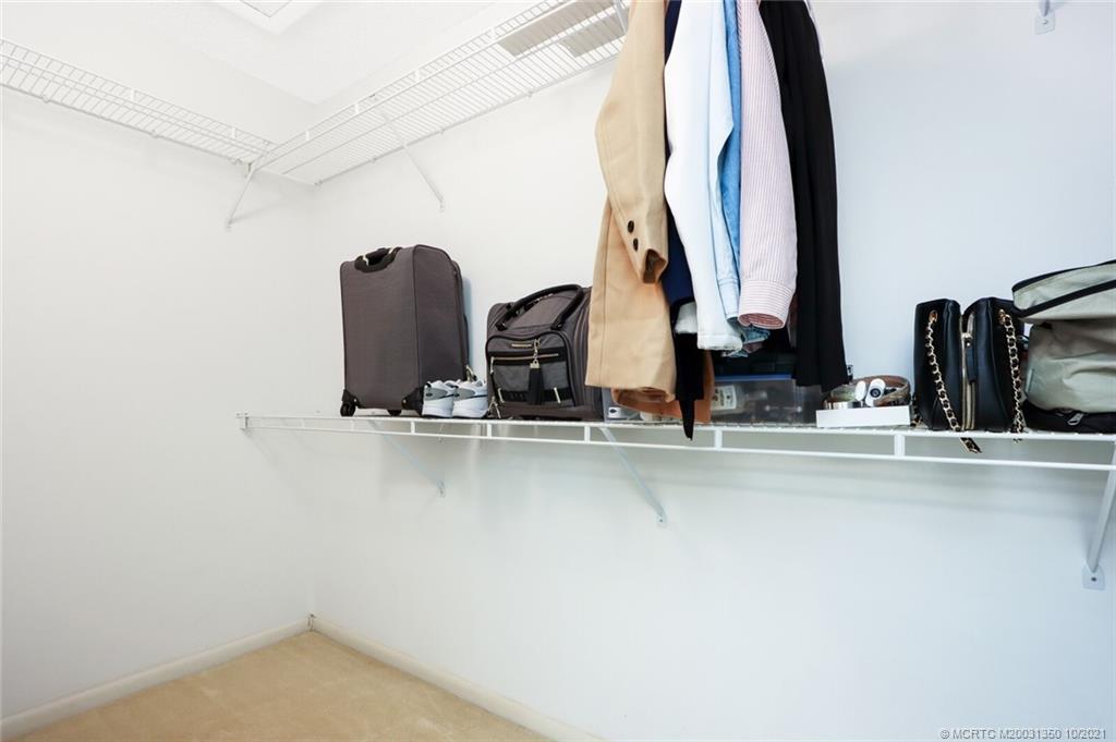 5443 Southeast Miles Grant Road, Unit D205 Stuart, FL 34997 - Photo 23 of 44 Oversized Walk-in Closet