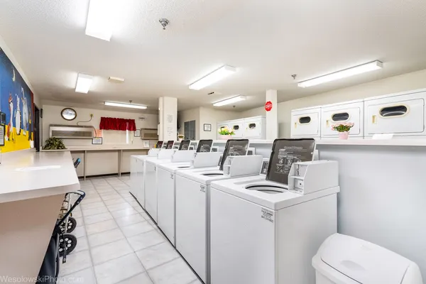 a kitchen with stainless steel appliances kitchen island granite countertop a sink and cabinets