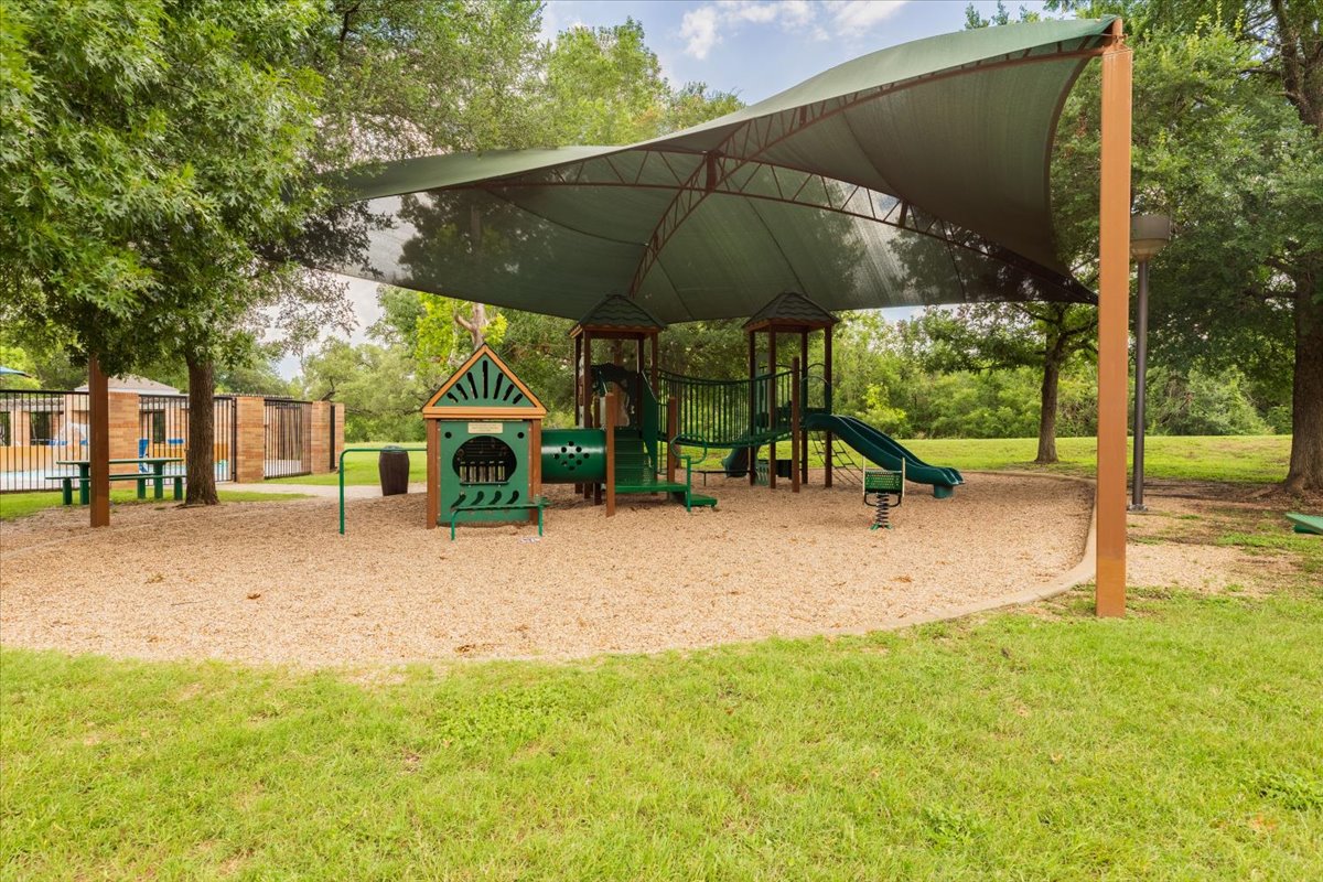 7136 Ridge Oak Road Austin, TX 78749 - Photo 39 of 40 A well-equipped playground with ample shade offers endless recreation for residents.