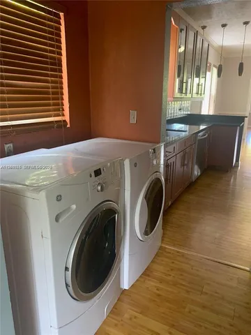 a view of a kitchen with washer and dryer
