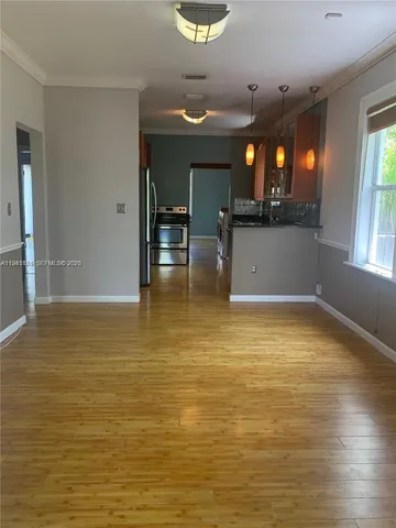 a room with lots of counter and windows