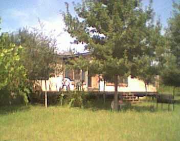 a view of residential house with outdoor space and lake view