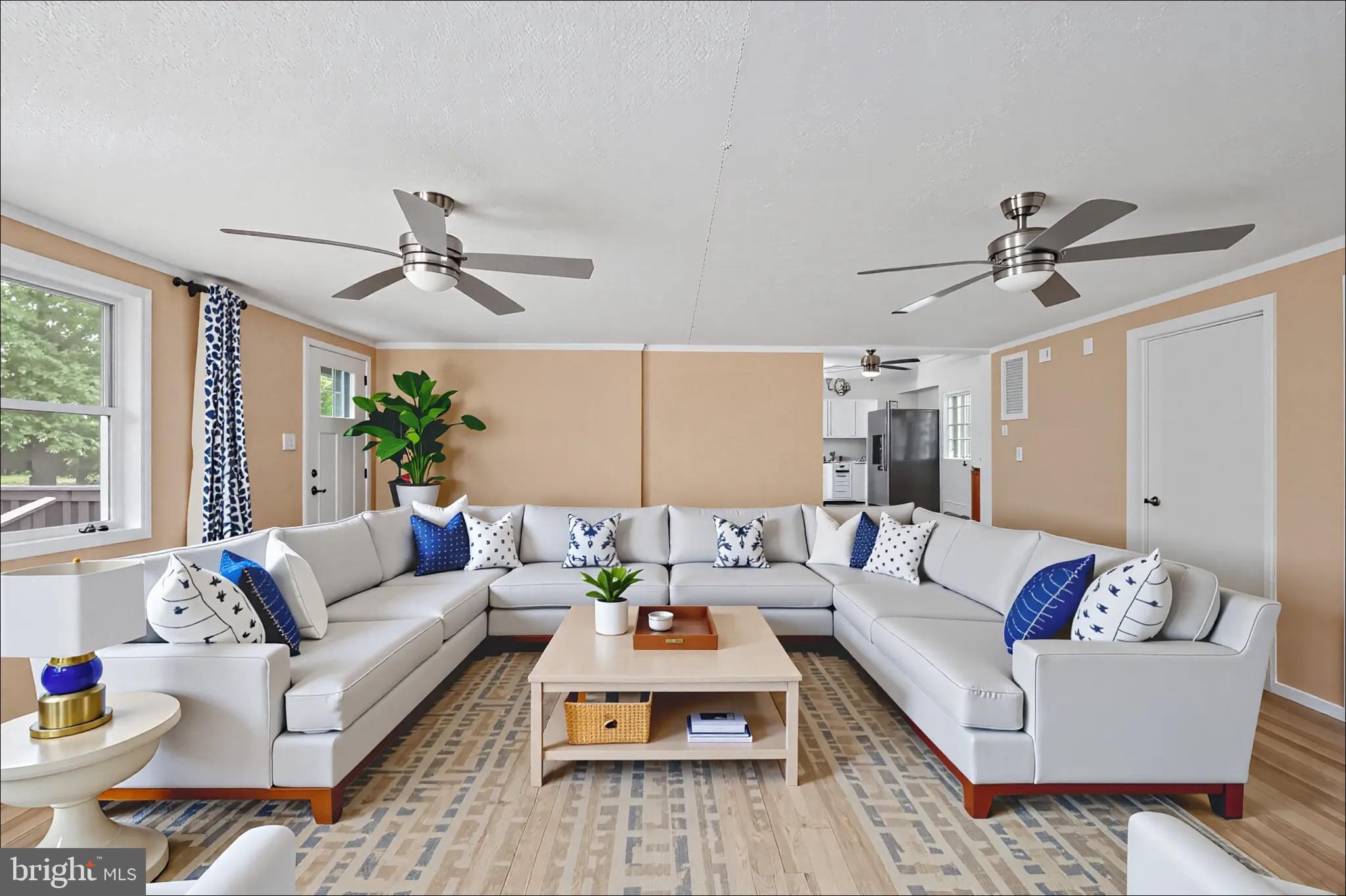 161 8th Street Colonial Beach, VA 22443 - Photo 11 of 71 a living room with furniture ceiling fan and a window