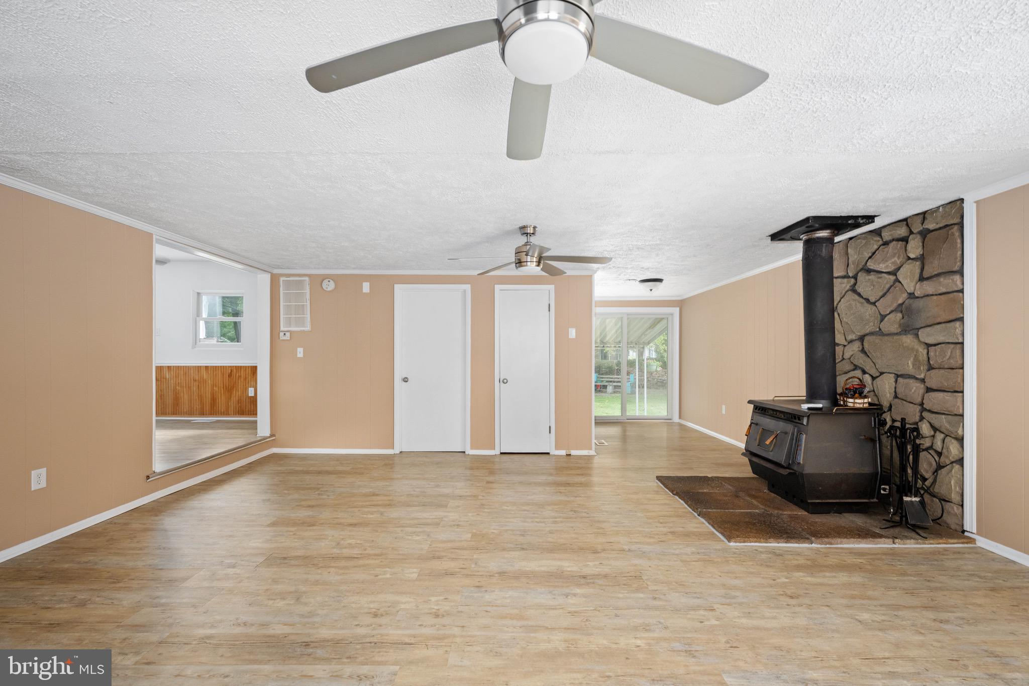 161 8th Street Colonial Beach, VA 22443 - Photo 14 of 71 a view of an empty room with window and wooden floor