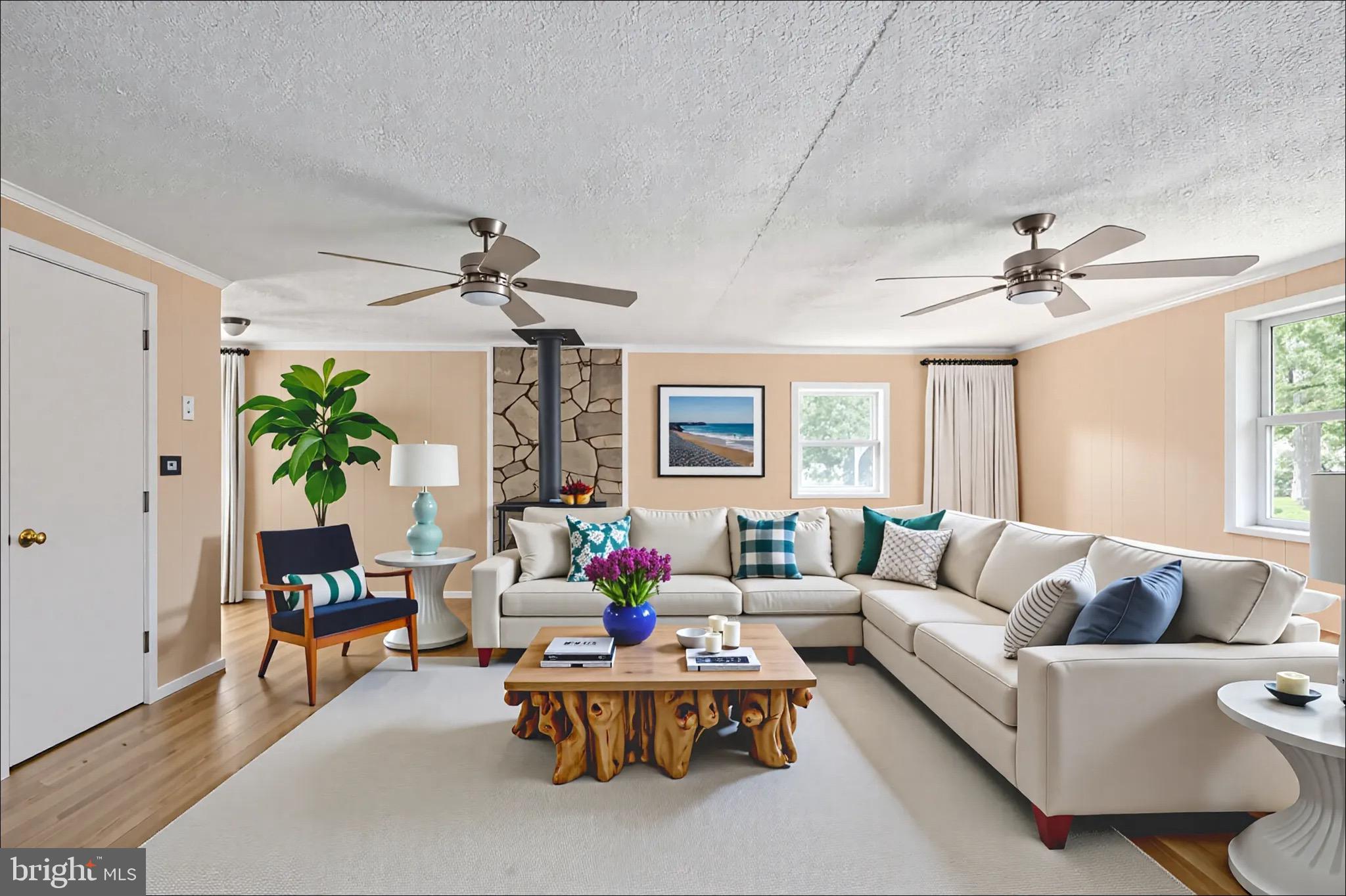161 8th Street Colonial Beach, VA 22443 - Photo 15 of 71 a living room with furniture a chandelier and a window