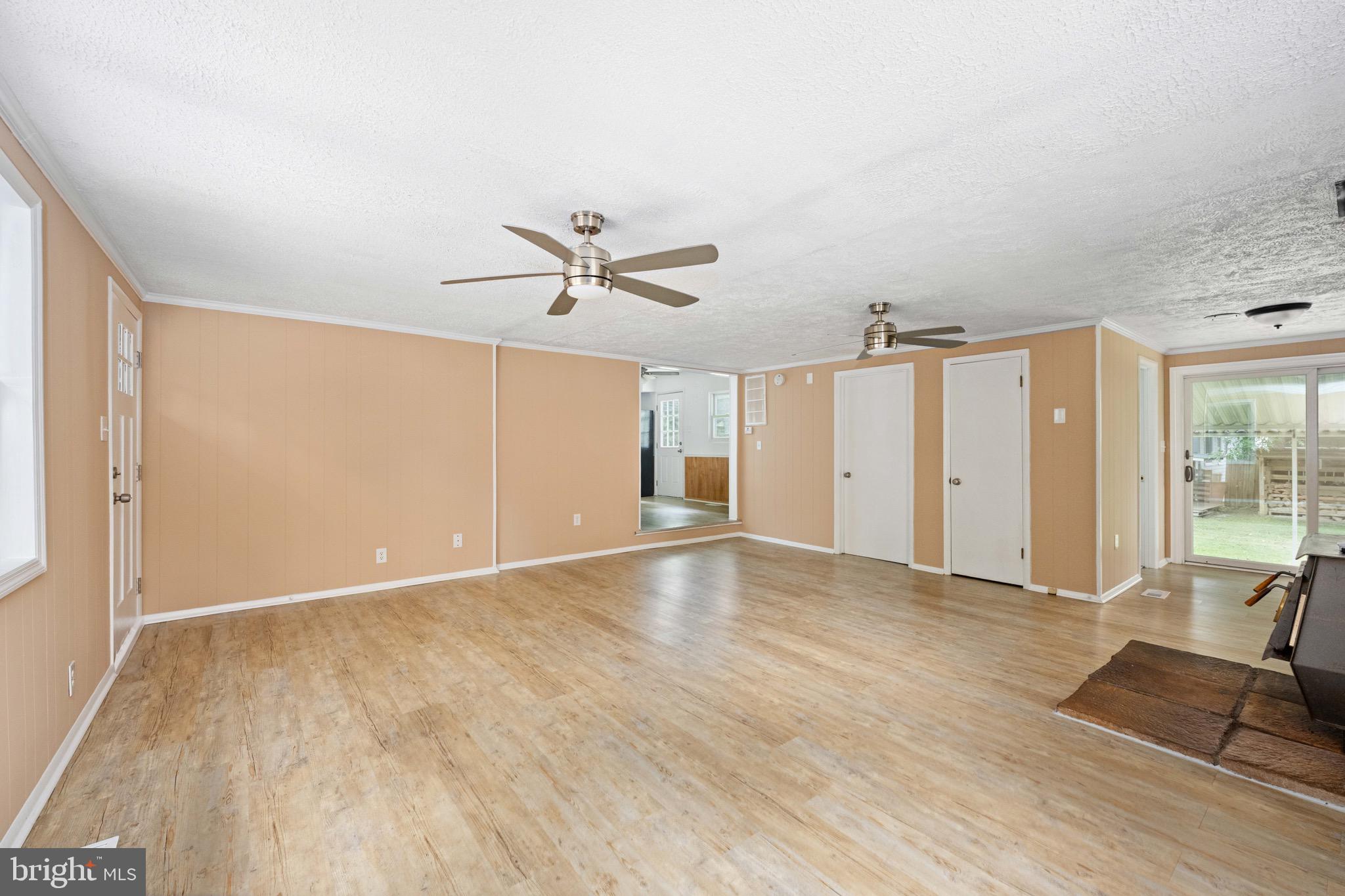 161 8th Street Colonial Beach, VA 22443 - Photo 19 of 71 VIEW ACROSS LIVING ROOM TO DINING AREA