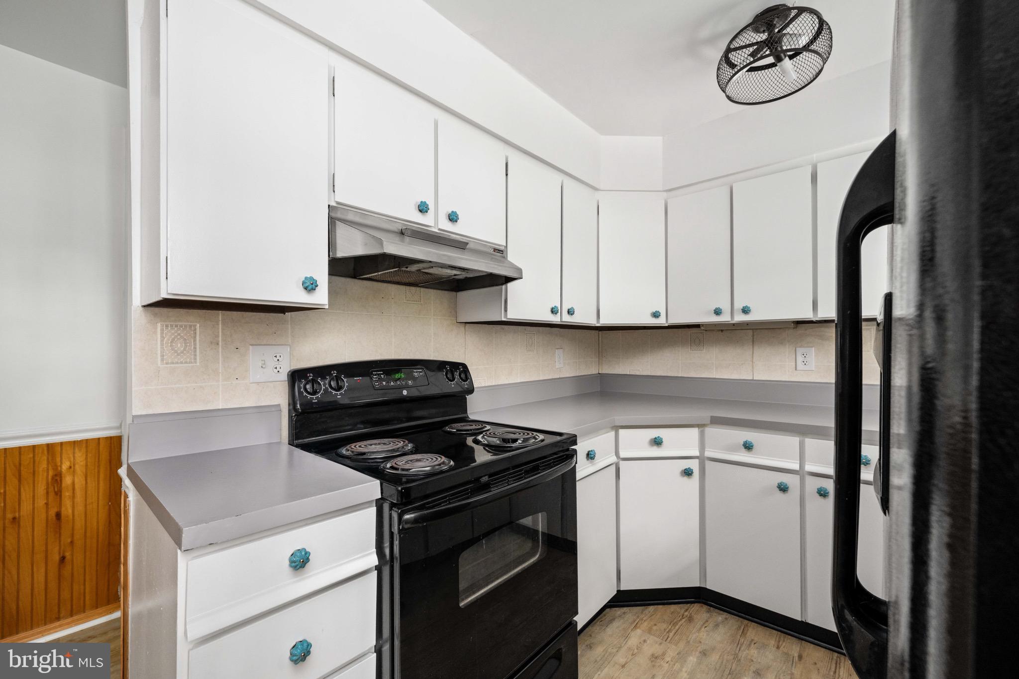 161 8th Street Colonial Beach, VA 22443 - Photo 23 of 71 a kitchen with stainless steel appliances granite countertop a stove and a refrigerator