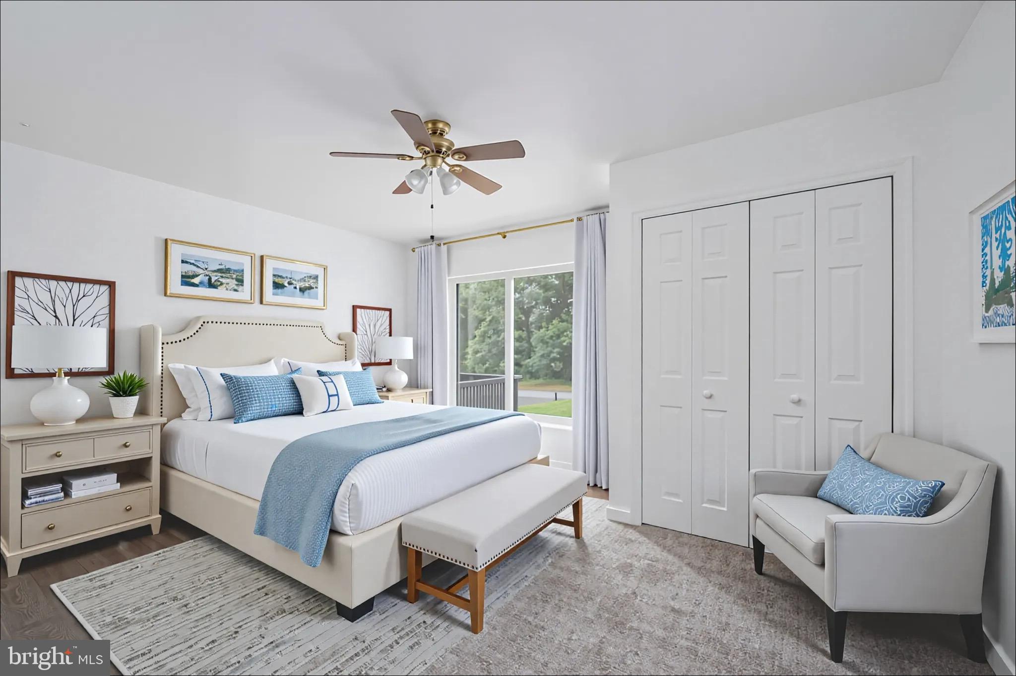 161 8th Street Colonial Beach, VA 22443 - Photo 26 of 71 a spacious bedroom with a bed a couch and a window