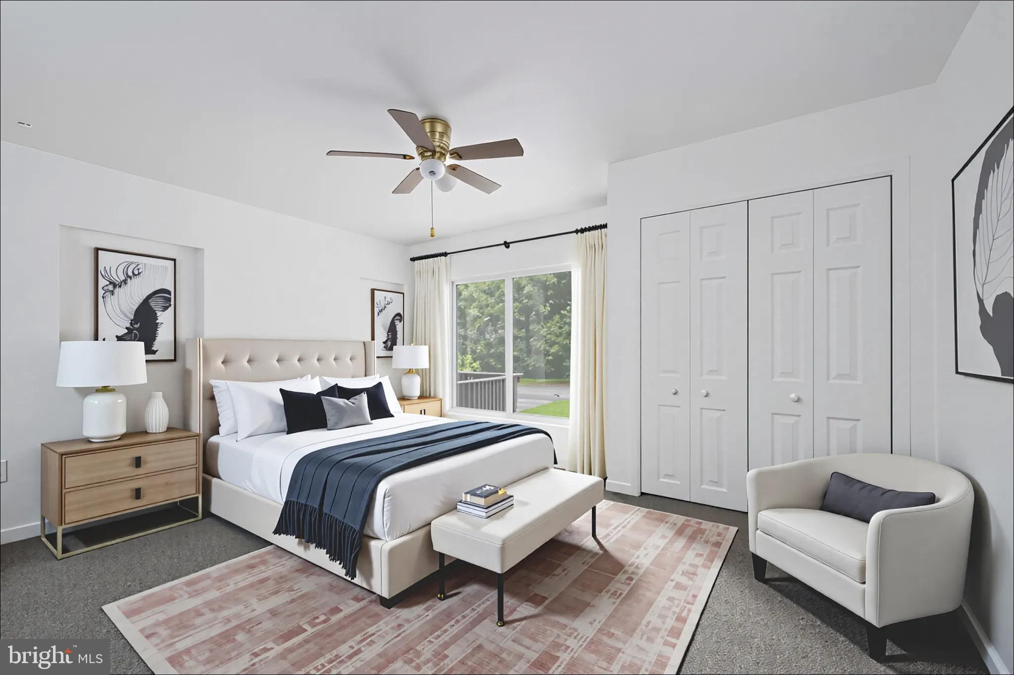 161 8th Street Colonial Beach, VA 22443 - Photo 28 of 71 a bedroom with a large bed couch and a window