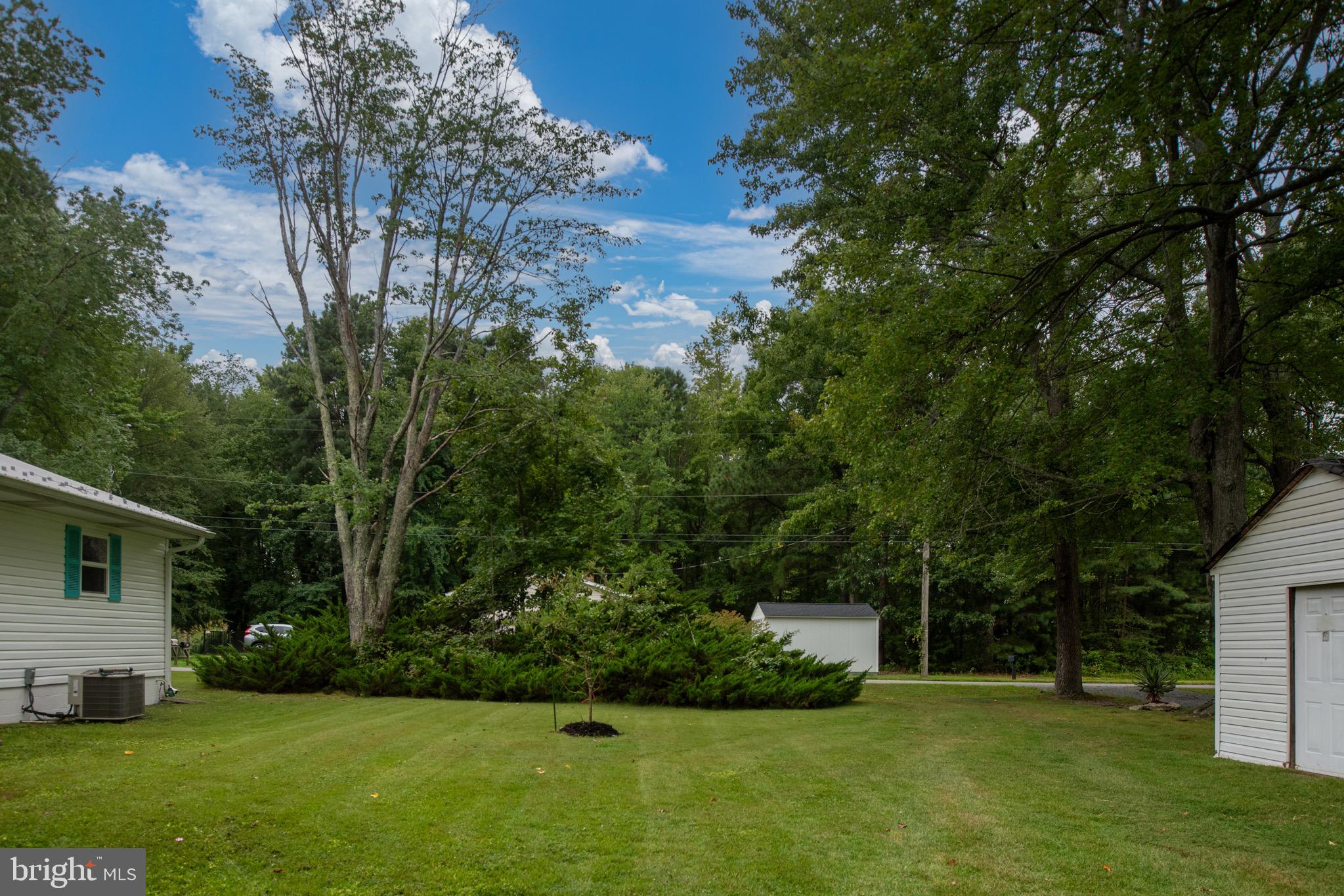 161 8th Street Colonial Beach, VA 22443 - Photo 3 of 71 a view of a house with a big yard