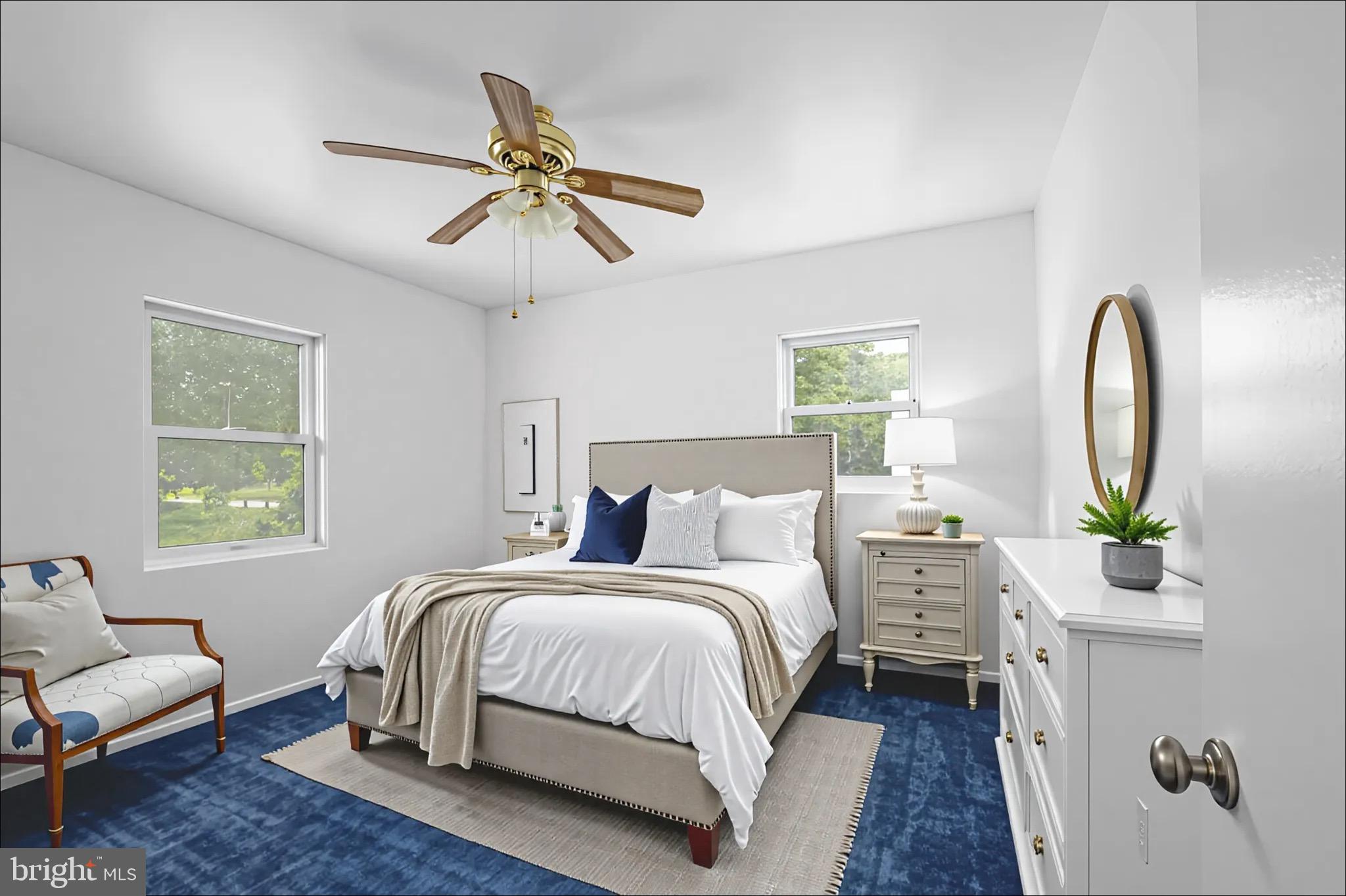 161 8th Street Colonial Beach, VA 22443 - Photo 33 of 71 a bedroom with a bed couch and window