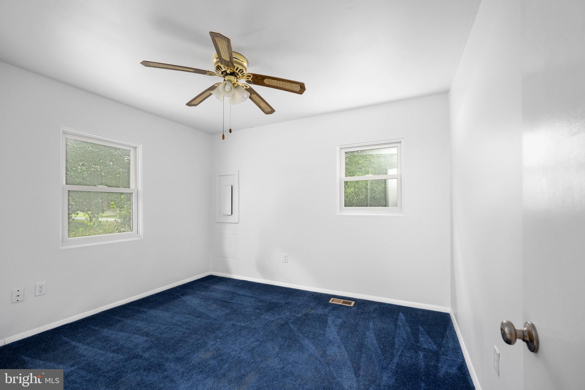 161 8th Street Colonial Beach, VA 22443 - Photo 34 of 71 wooden floor in an empty room with a window