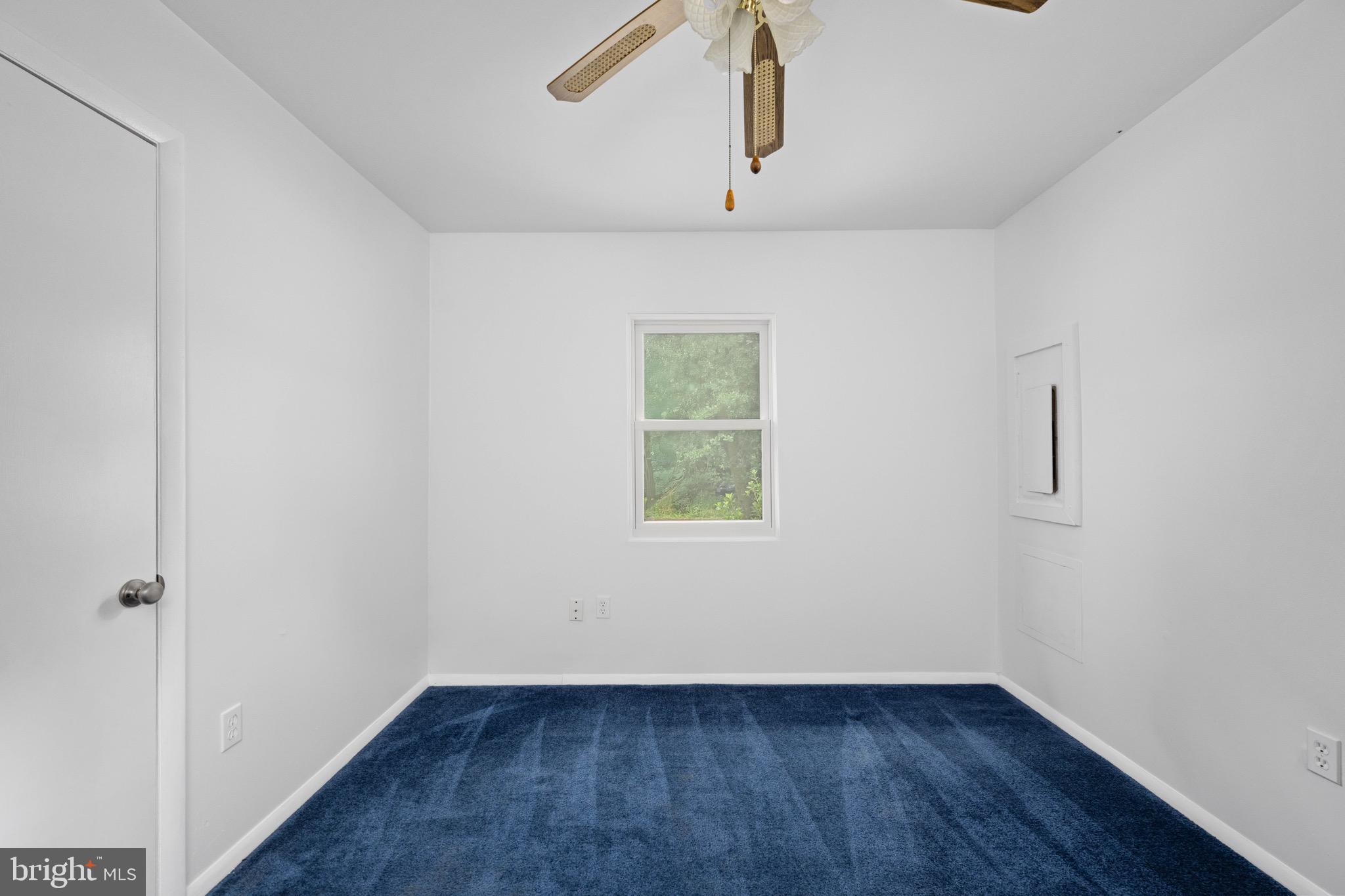 161 8th Street Colonial Beach, VA 22443 - Photo 35 of 71 wooden floor in an empty room