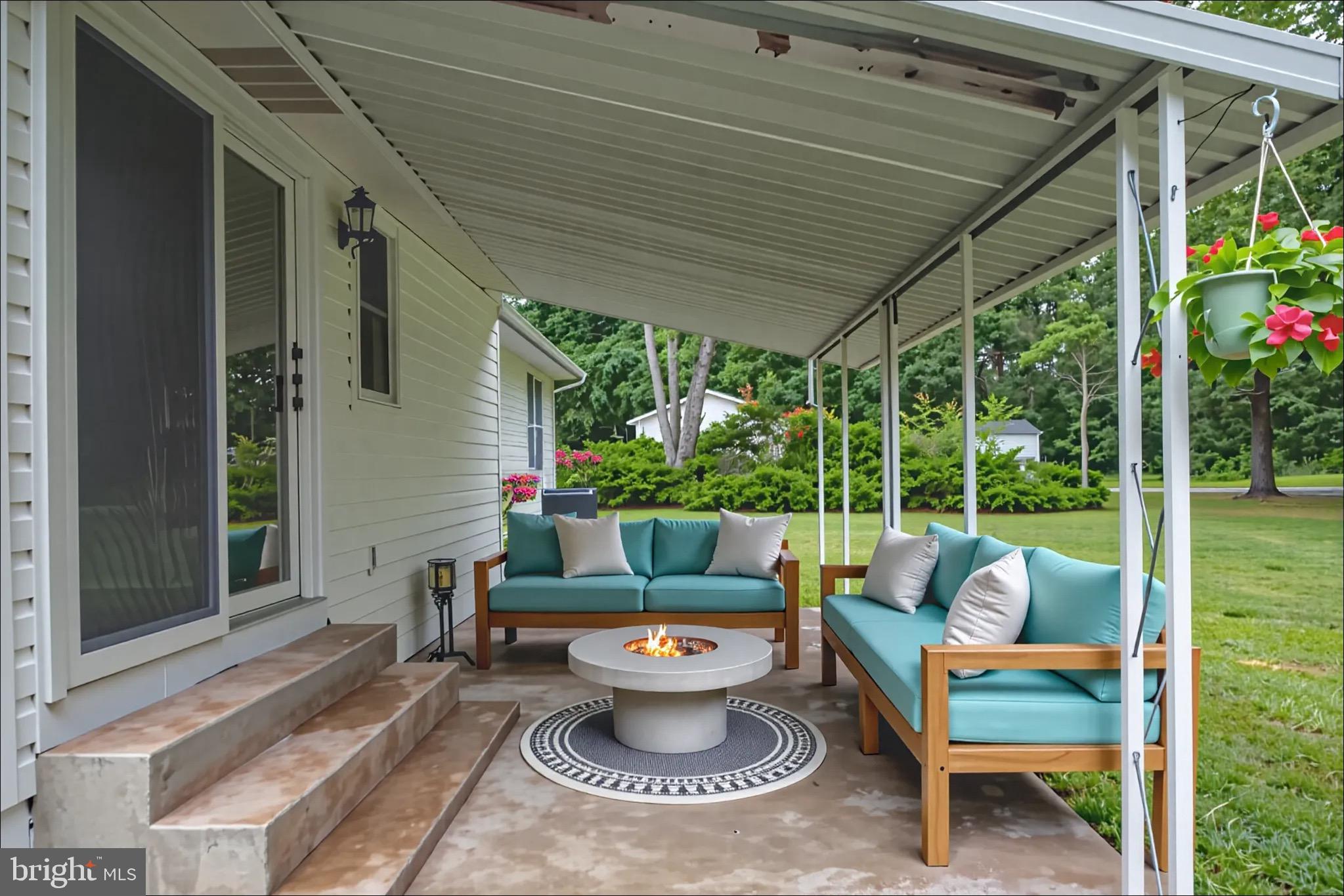 161 8th Street Colonial Beach, VA 22443 - Photo 44 of 71 a view of a patio with couches chairs and plants