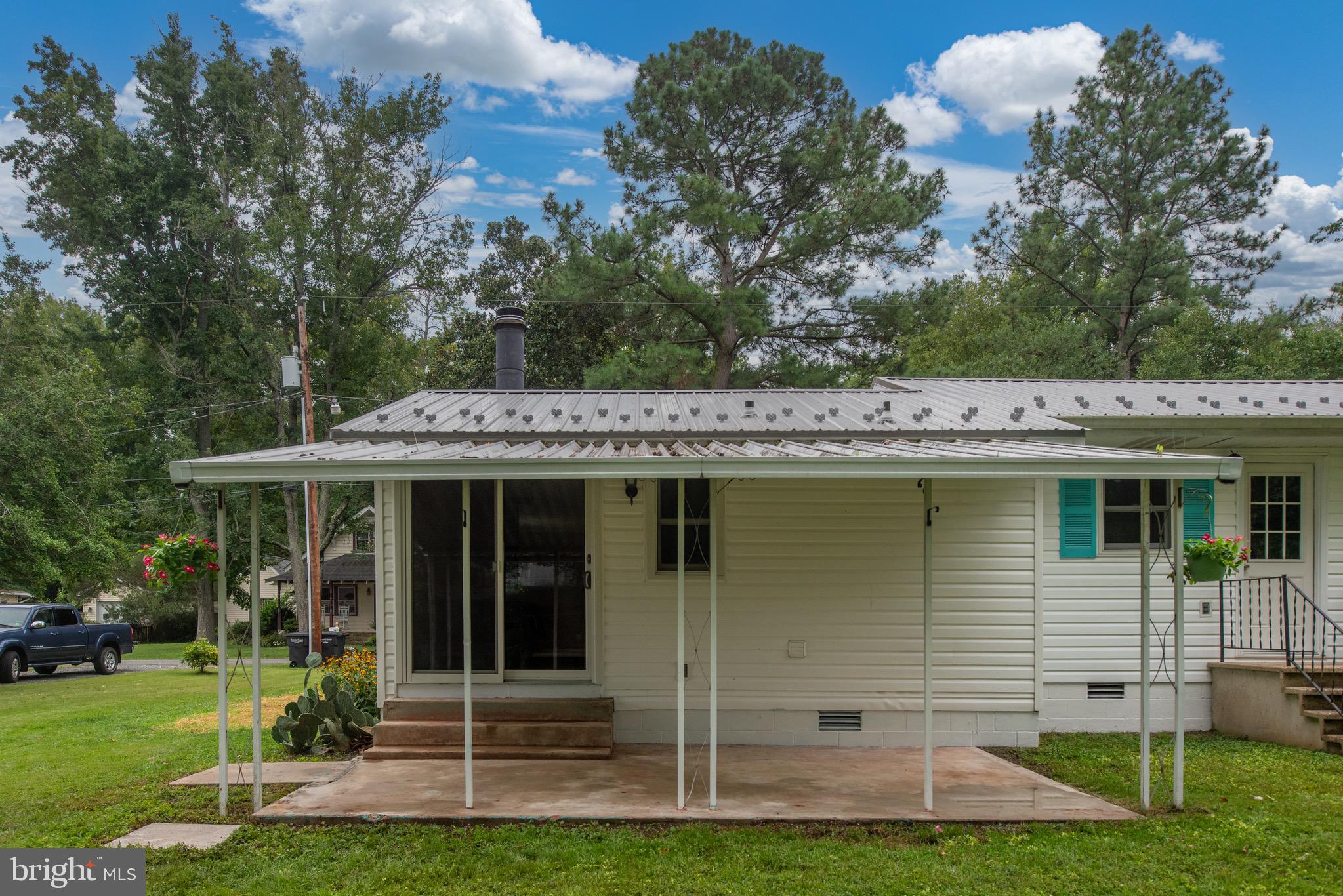 161 8th Street Colonial Beach, VA 22443 - Photo 46 of 71 a front view of a house with a yard