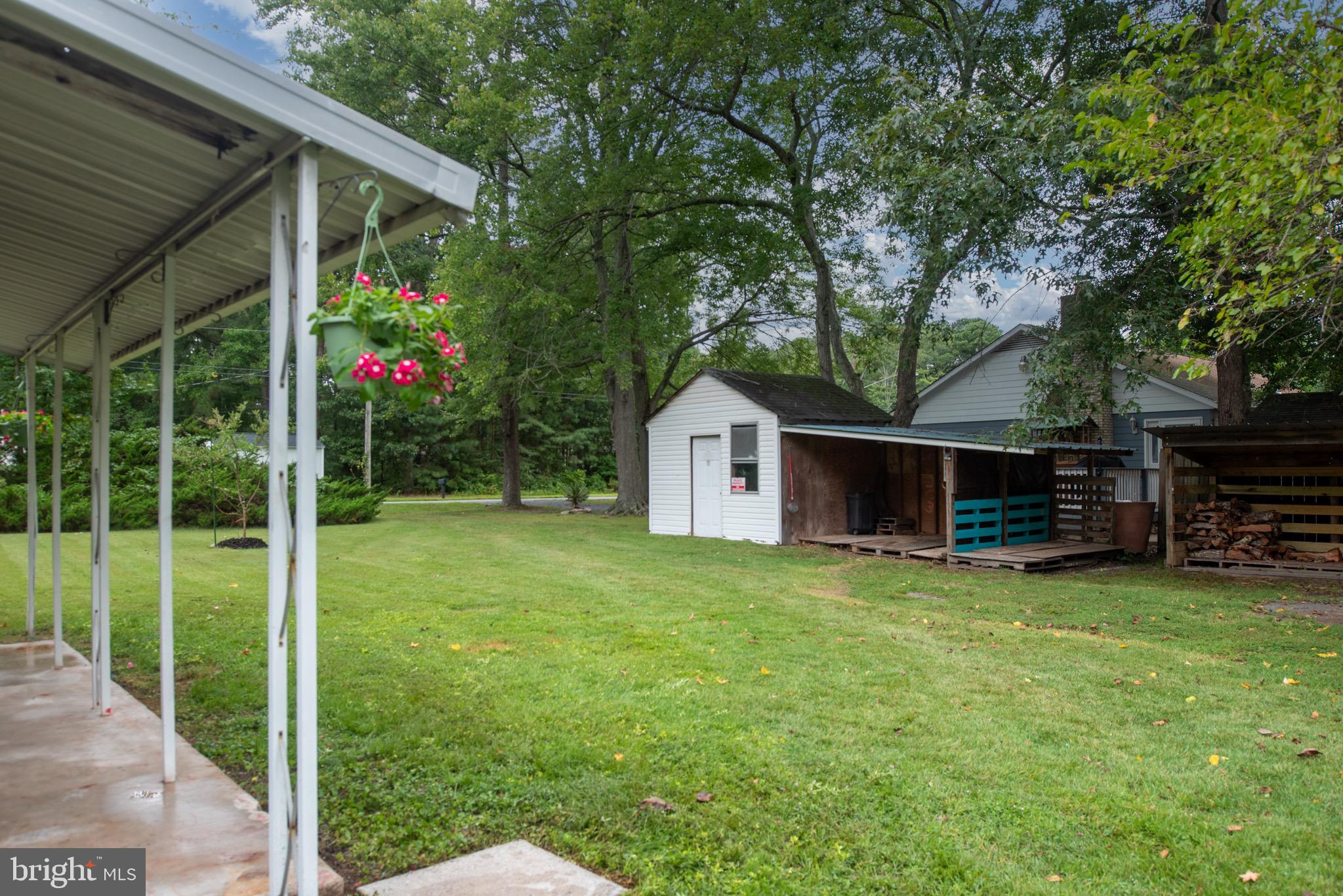 161 8th Street Colonial Beach, VA 22443 - Photo 47 of 71 a view of a house with a yard and sitting area