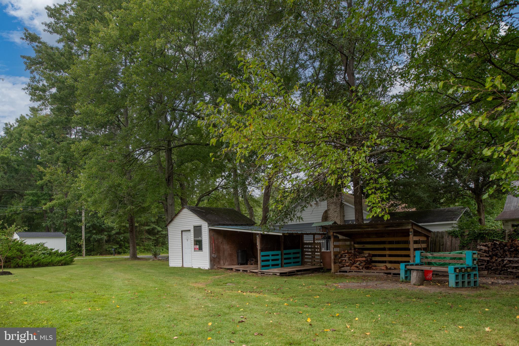 161 8th Street Colonial Beach, VA 22443 - Photo 54 of 71 a view of a house with a yard and sitting area