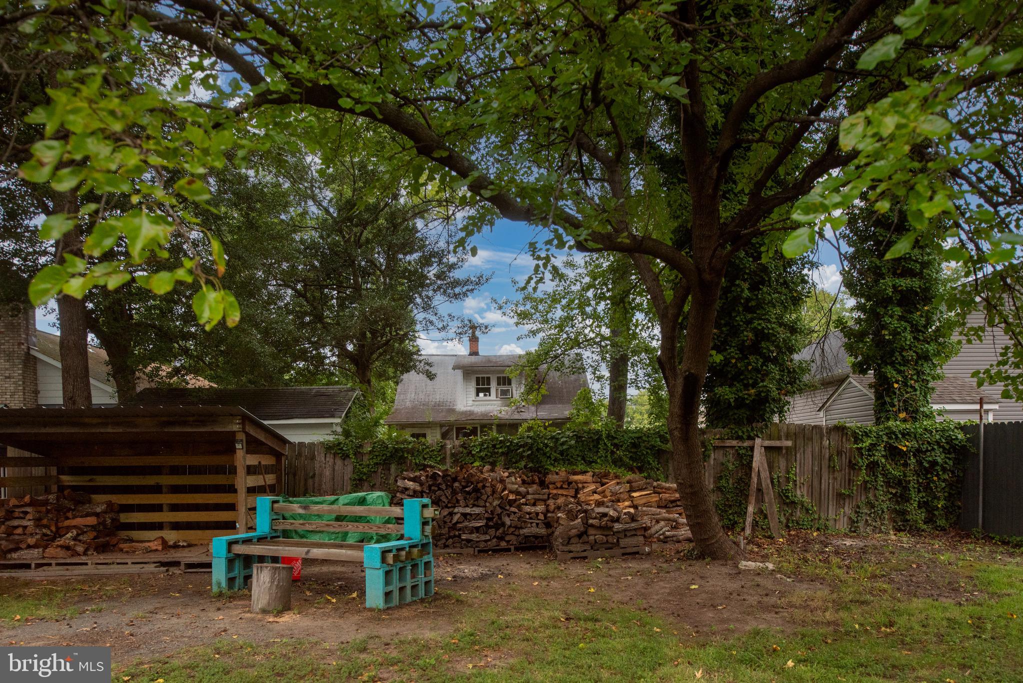 161 8th Street Colonial Beach, VA 22443 - Photo 55 of 71 a view of house with backyard outdoor seating and plants